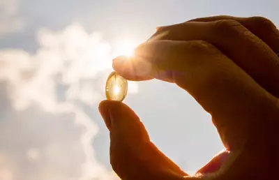 Vitamina do sol e capsula de vitamina D